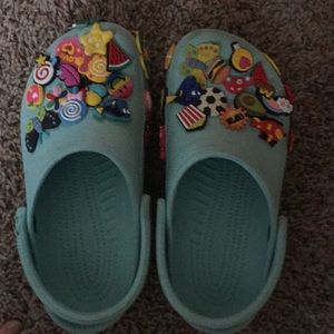 Lightly worn women’s blue crocs come with jibbitz